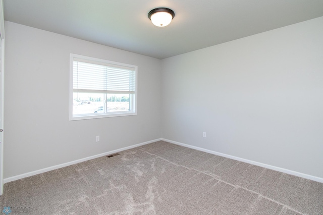1449 68th Ave S, Fargo, ND 58104 - carpeted empty room featuring baseboards