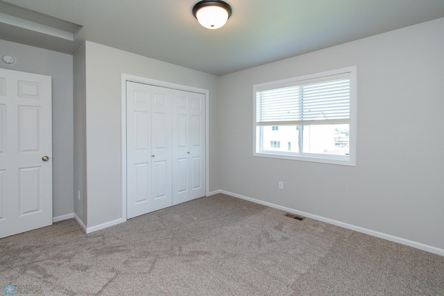1449 68th Ave S, Fargo, ND 58104 - unfurnished bedroom featuring carpet and a closet