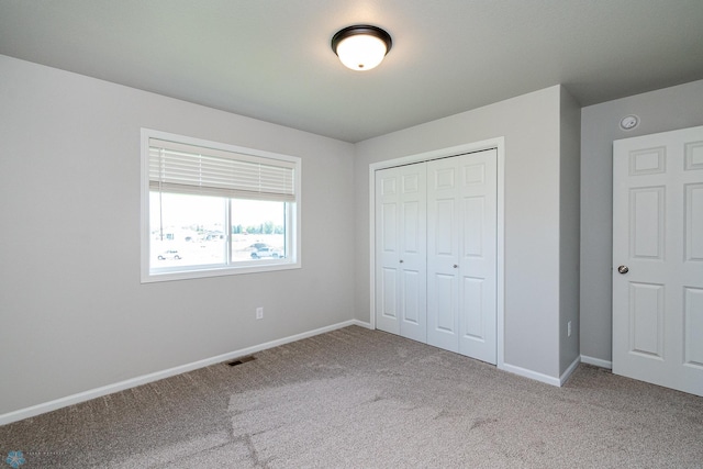 1449 68th Ave S, Fargo, ND 58104 - unfurnished bedroom featuring carpet and a closet