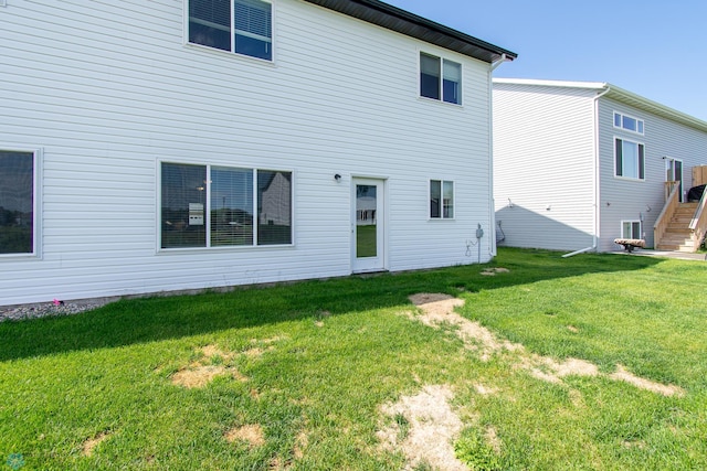 1449 68th Ave S, Fargo, ND 58104 - rear view of property featuring a yard