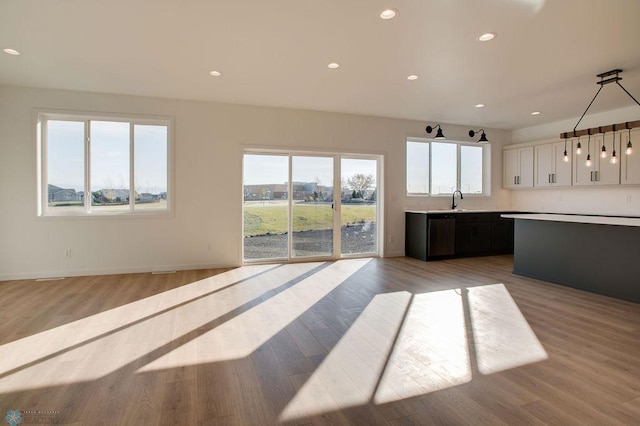 419 Reese Way, Mapleton, ND 58059 - unfurnished living room with light wood finished floors and recessed lighting
