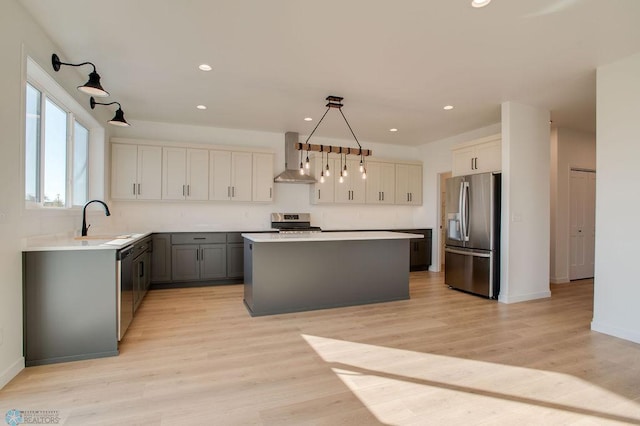419 Reese Way, Mapleton, ND 58059 - kitchen with stainless steel appliances, wall chimney exhaust hood, a center island, recessed lighting, and light countertops