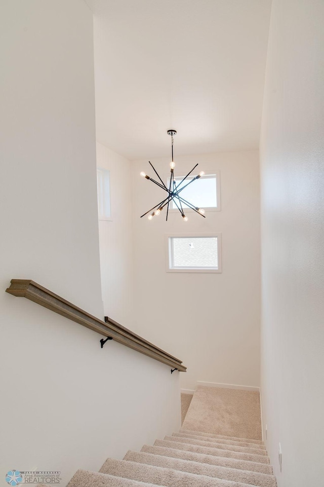 419 Reese Way, Mapleton, ND 58059 - stairs with a chandelier and carpet floors