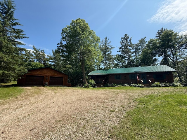 40257 Elbow Lake Store Rd, Round Lake N Twp, MN 56589 - view of front of house with a garage, an outbuilding, a front lawn, and a metal roof