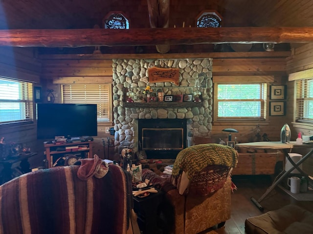 40257 Elbow Lake Store Rd, Round Lake N Twp, MN 56589 - living room featuring hardwood / wood-style floors, wood walls, a stone fireplace, and beamed ceiling