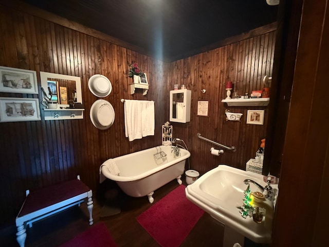 40257 Elbow Lake Store Rd, Round Lake N Twp, MN 56589 - bathroom with a freestanding tub, wood walls, and wood finished floors