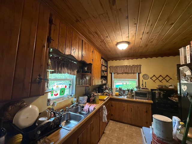 40257 Elbow Lake Store Rd, Round Lake N Twp, MN 56589 - kitchen with wooden ceiling, brown cabinets, and light countertops