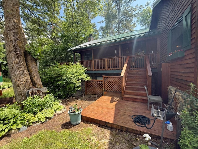 40257 Elbow Lake Store Rd, Round Lake N Twp, MN 56589 - back of house with a chimney, a deck, stairway, and a metal roof