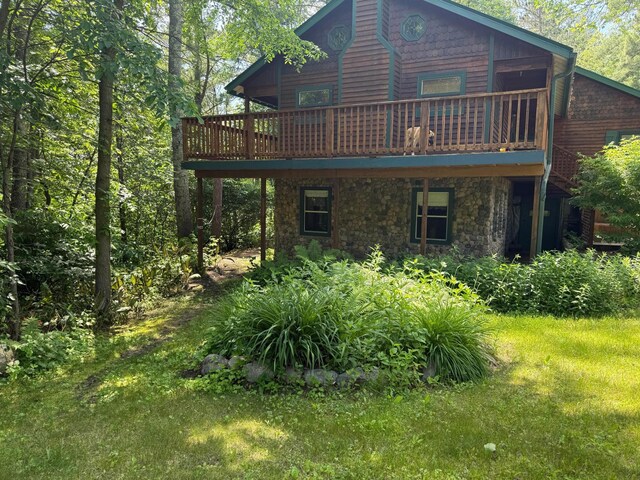 40257 Elbow Lake Store Rd, Round Lake N Twp, MN 56589 - rear view of house featuring stone siding and a wooden deck
