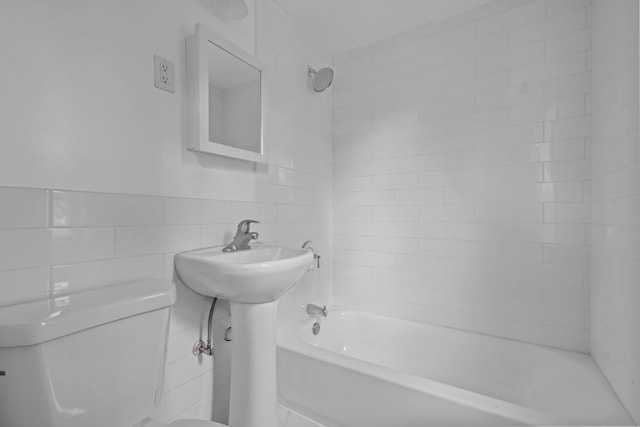 1289 Galtier St, Saint Paul, MN 55117 - bathroom featuring tile walls and tub / shower combination