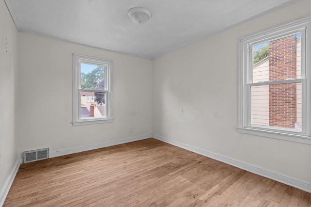 1289 Galtier St, Saint Paul, MN 55117 - empty room featuring healthy amount of natural light and light wood-style floors