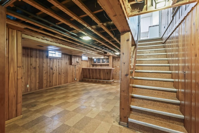 1289 Galtier St, Saint Paul, MN 55117 - basement with tile patterned floors, stairway, and wood walls