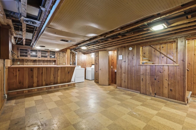1289 Galtier St, Saint Paul, MN 55117 - finished basement featuring tile patterned floors, separate washer and dryer, and wood walls