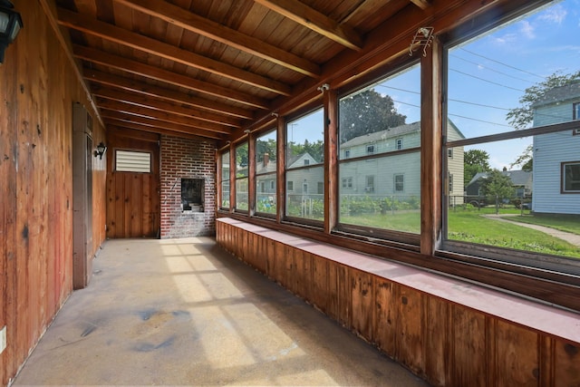 1289 Galtier St, Saint Paul, MN 55117 - unfurnished sunroom featuring wood walls and a wood ceiling with exposed beams