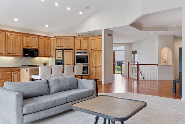 343 Waycliffe Dr N, Wayzata, MN 55391 - living room featuring recessed lighting, light wood finished floors, ornamental molding, and vaulted ceiling