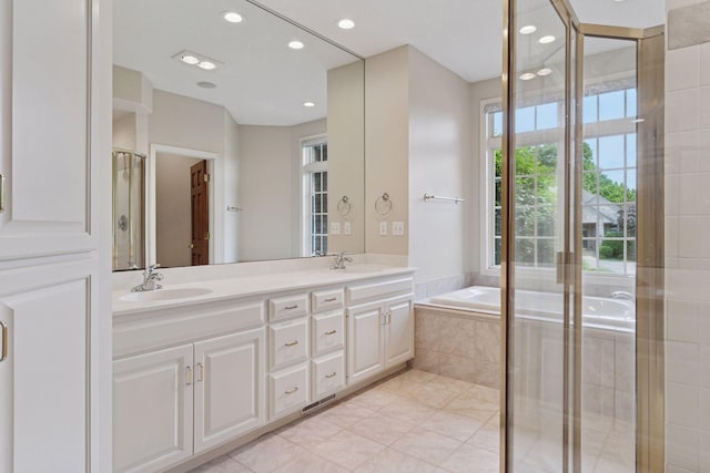 343 Waycliffe Dr N, Wayzata, MN 55391 - full bathroom with double vanity, a bath, recessed lighting, tile patterned floors, and a shower stall