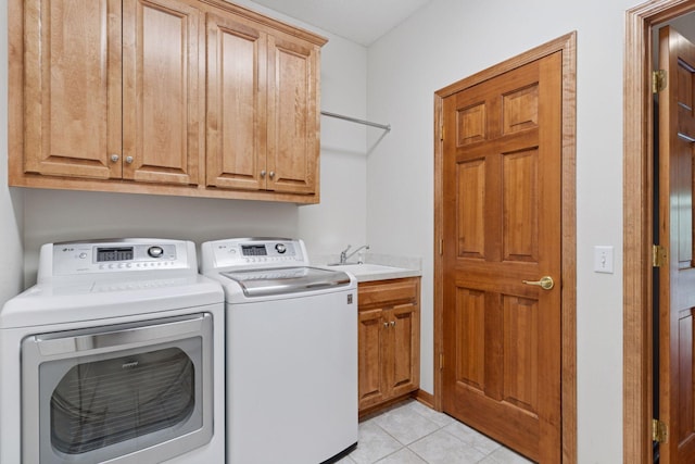 343 Waycliffe Dr N, Wayzata, MN 55391 - laundry room with washing machine and dryer, cabinet space, and light tile patterned floors