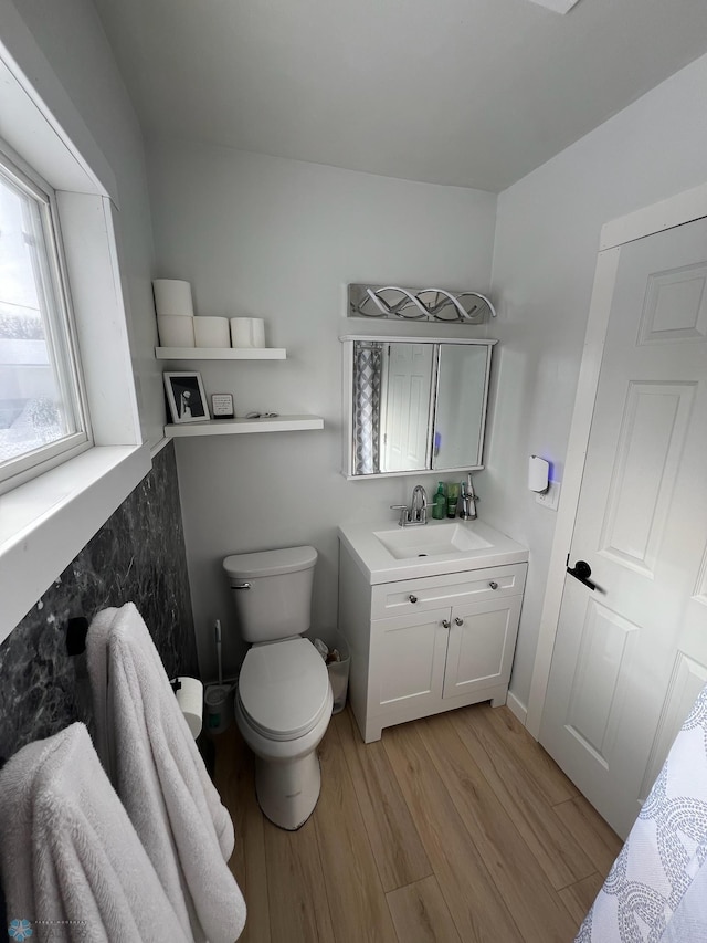 1822 7th Ave S, Fargo, ND 58103 - bathroom with wood finished floors and vanity