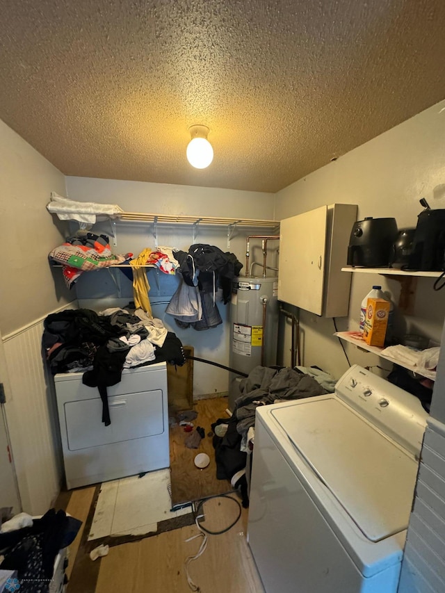 1822 7th Ave S, Fargo, ND 58103 - laundry area with electric water heater, a textured ceiling, washing machine and clothes dryer, and light wood-style floors