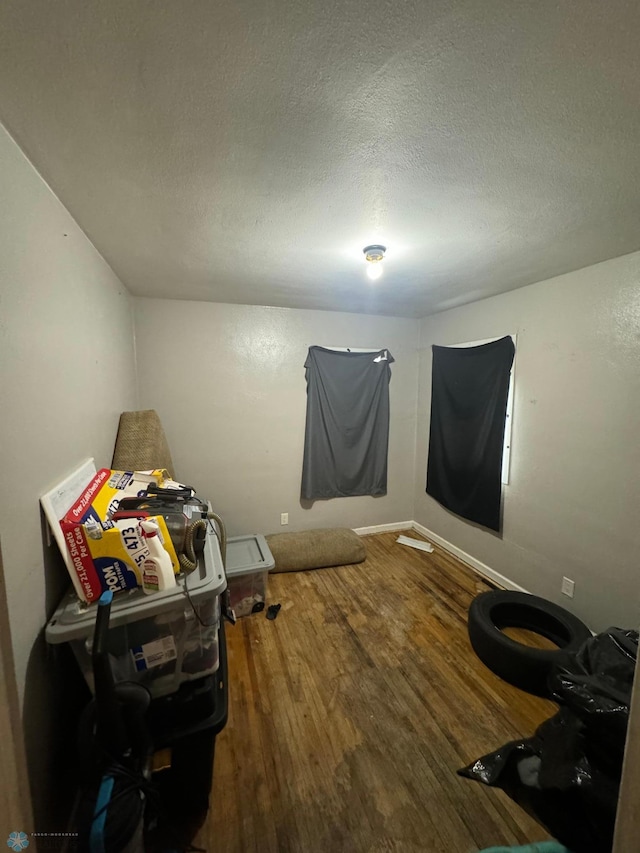 1822 7th Ave S, Fargo, ND 58103 - miscellaneous room featuring wood finished floors and a textured ceiling