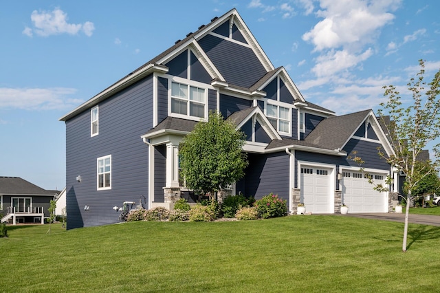 15560 110th Ave N, Dayton, MN 55369 - craftsman-style house with a front lawn, driveway, a shingled roof, and stone siding