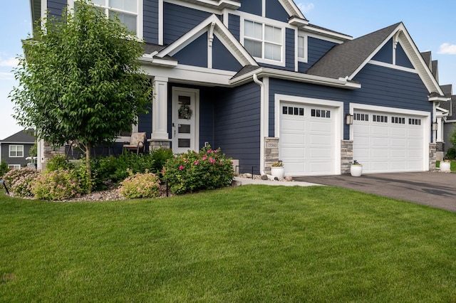 15560 110th Ave N, Dayton, MN 55369 - craftsman-style home featuring a front lawn, driveway, stone siding, and a shingled roof