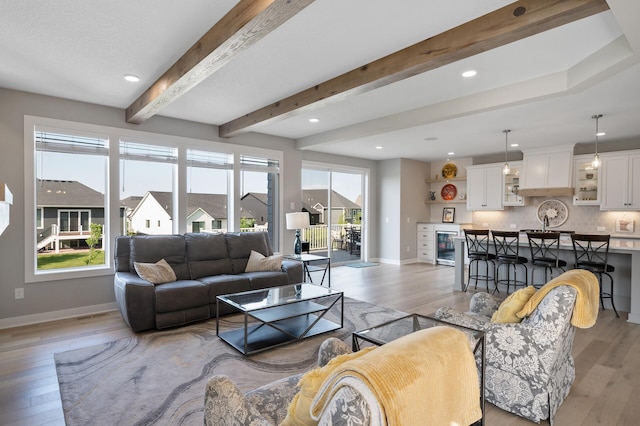 15560 110th Ave N, Dayton, MN 55369 - living room with light wood-type flooring, beamed ceiling, recessed lighting, and beverage cooler