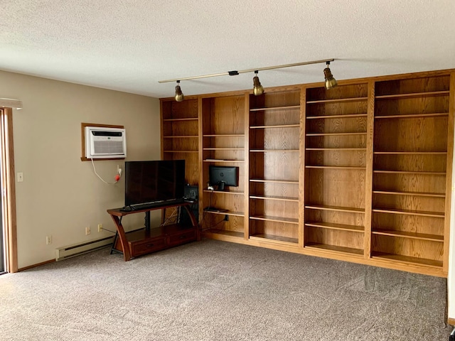2419 25 1/2 Ave S Unit 205, Fargo, ND 58103 - unfurnished living room with carpet floors, a wall mounted AC, a textured ceiling, and rail lighting