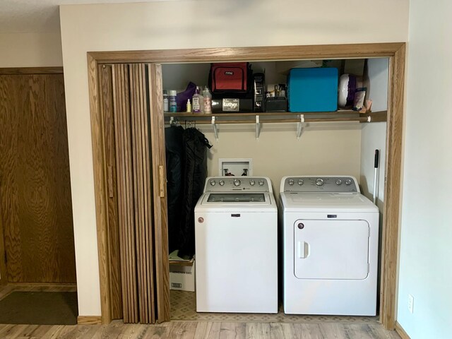 2419 25 1/2 Ave S Unit 205, Fargo, ND 58103 - washroom featuring independent washer and dryer and light wood-style floors