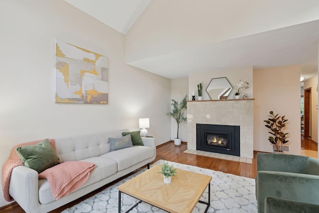 729 Summit Ave, Saint Paul, MN 55105 - living area with wood finished floors, a fireplace, and lofted ceiling