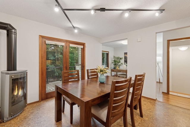 729 Summit Ave, Saint Paul, MN 55105 - dining room featuring rail lighting and a textured ceiling