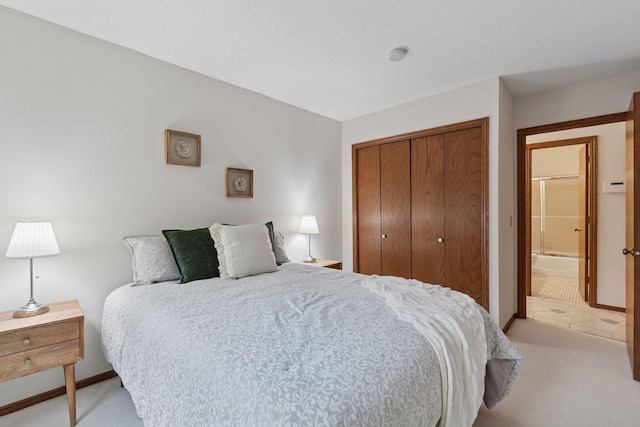 729 Summit Ave, Saint Paul, MN 55105 - bedroom featuring a closet, light colored carpet, and light tile patterned floors