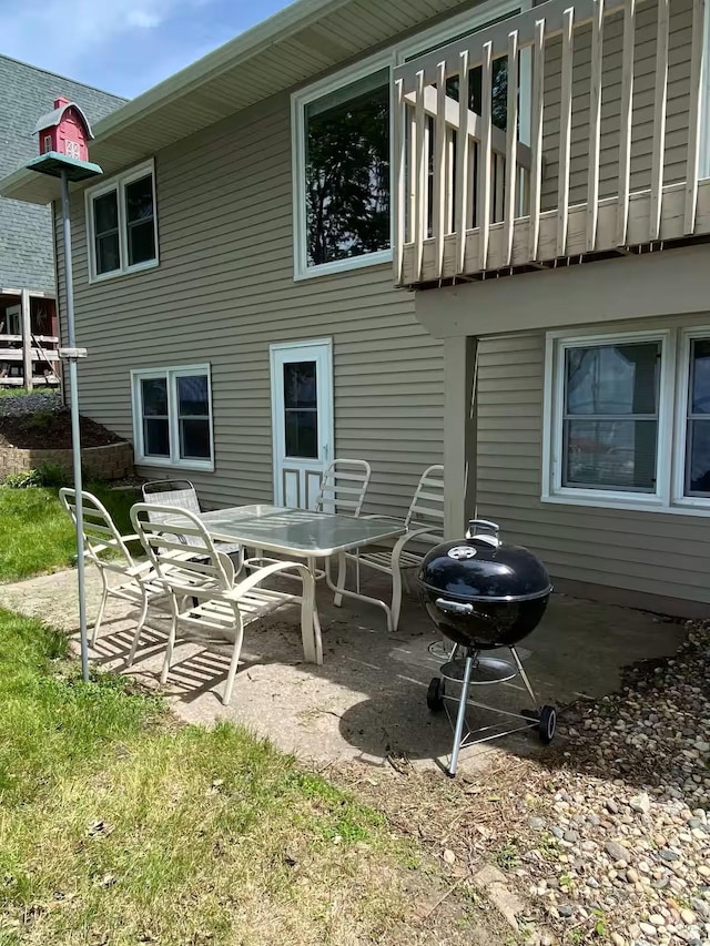 5960 165th St NE, Atwater, MN 56209 - rear view of property with a patio area, a balcony, and outdoor dining space