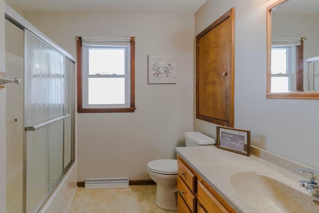 5960 165th St NE, Atwater, MN 56209 - bathroom featuring vanity, baseboard heating, and shower / bath combination with glass door