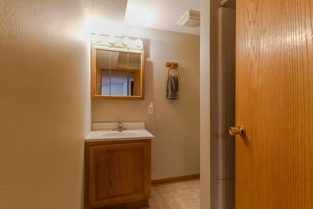 5960 165th St NE, Atwater, MN 56209 - bathroom with vanity and a textured ceiling