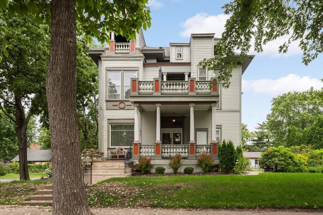 977 Portland Ave Unit 1, Saint Paul, MN 55104 - view of front of property with a balcony, covered porch, and a front yard