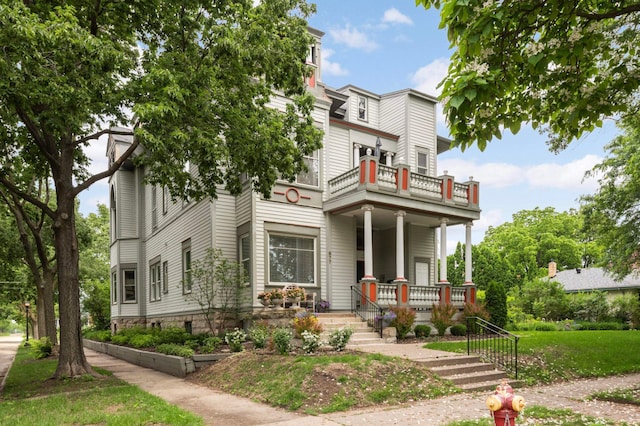 977 Portland Ave Unit 1, Saint Paul, MN 55104 - view of front of house with a balcony and covered porch