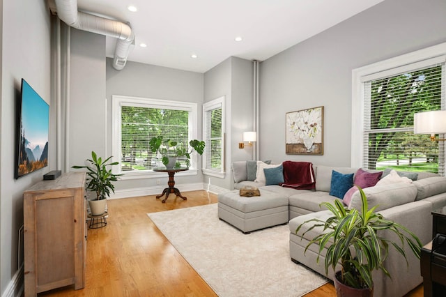 977 Portland Ave Unit 1, Saint Paul, MN 55104 - living room featuring wood finished floors, recessed lighting, and plenty of natural light