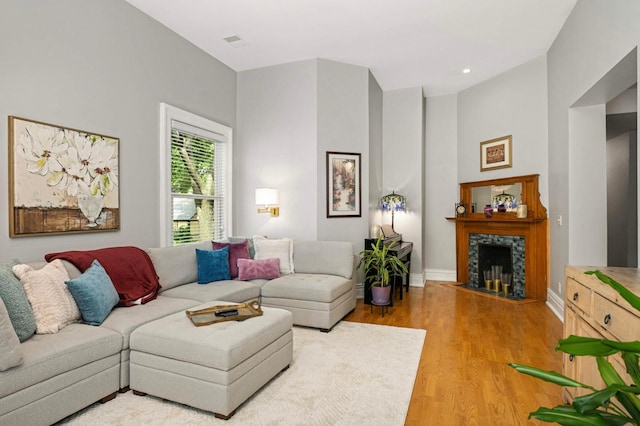 977 Portland Ave Unit 1, Saint Paul, MN 55104 - living area with light wood-style flooring and a fireplace