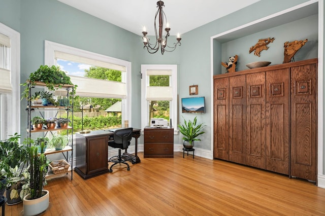 977 Portland Ave Unit 1, Saint Paul, MN 55104 - home office featuring light wood-type flooring and a chandelier