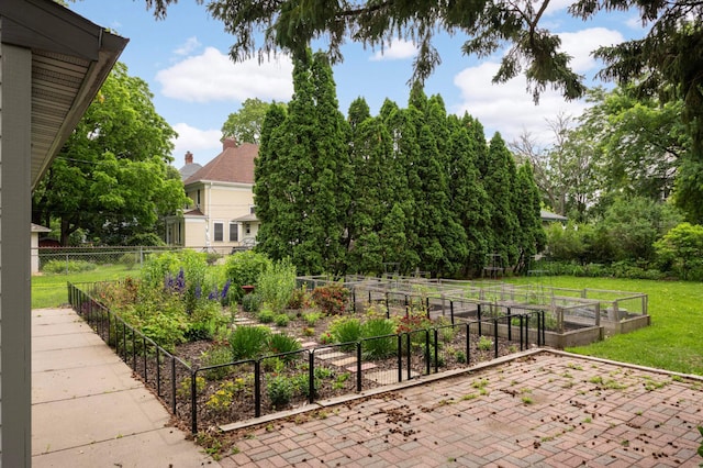 977 Portland Ave Unit 1, Saint Paul, MN 55104 - view of yard with a vegetable garden and a patio