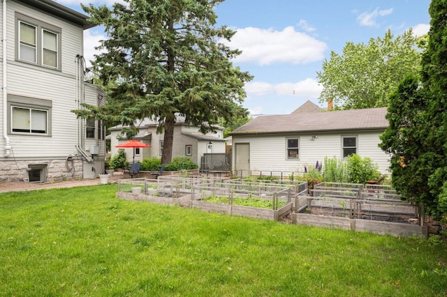 977 Portland Ave Unit 1, Saint Paul, MN 55104 - view of grassy yard with a vegetable garden
