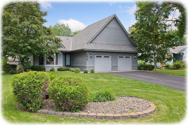 7516 Colorado Ave N, Brooklyn Park, MN 55443 - view of front of home featuring an attached garage, a shingled roof, a front yard, and driveway