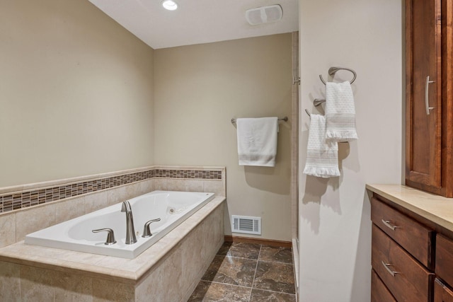 7516 Colorado Ave N, Brooklyn Park, MN 55443 - bathroom featuring a jetted tub and vanity