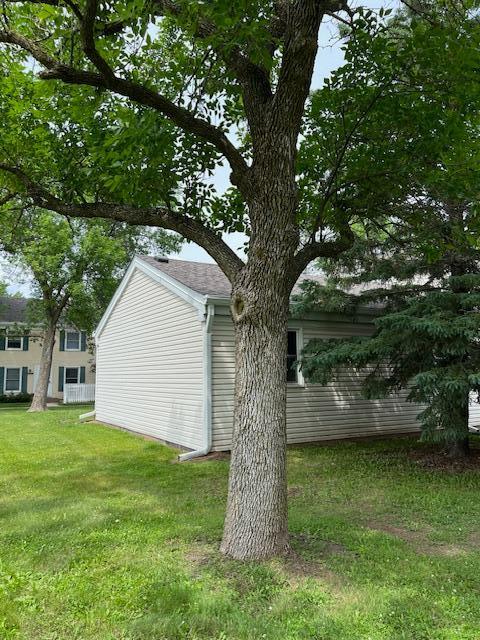 4918 Grenwich Trl N, Oakdale, MN 55128 - view of side of property with a lawn