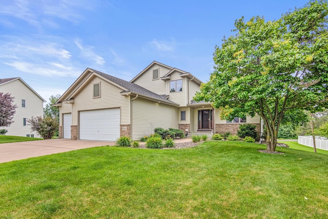 22027 Ethan Ave, Forest Lake, MN 55025 - view of front facade featuring brick siding, an attached garage, concrete driveway, and roof with shingles