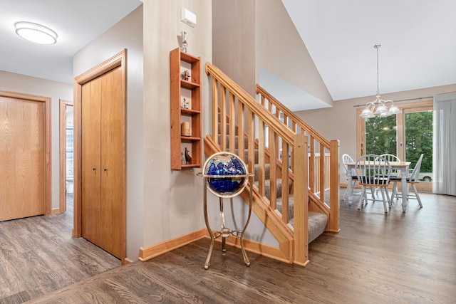 22027 Ethan Ave, Forest Lake, MN 55025 - stairway with wood finished floors, a chandelier, and lofted ceiling