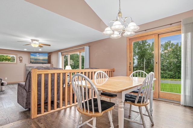 22027 Ethan Ave, Forest Lake, MN 55025 - dining room featuring wood finished floors, a chandelier, a ceiling fan, and recessed lighting