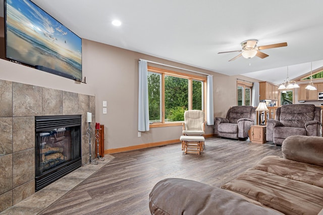 22027 Ethan Ave, Forest Lake, MN 55025 - living area featuring healthy amount of natural light, ceiling fan, wood finished floors, a fireplace, and lofted ceiling