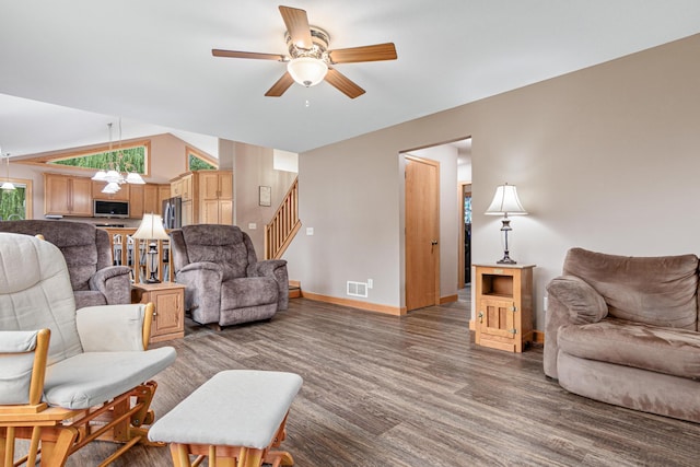 22027 Ethan Ave, Forest Lake, MN 55025 - living room featuring ceiling fan, wood finished floors, stairs, vaulted ceiling, and a chandelier